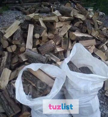 Фото Березовые колотые дрова в мешках