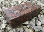 фото Каменная гранитная брусчатка из красного гранита пиленая