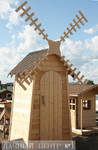 фото Садовый туалет из дерева для дачи "Мельница" 1,40х1,40м